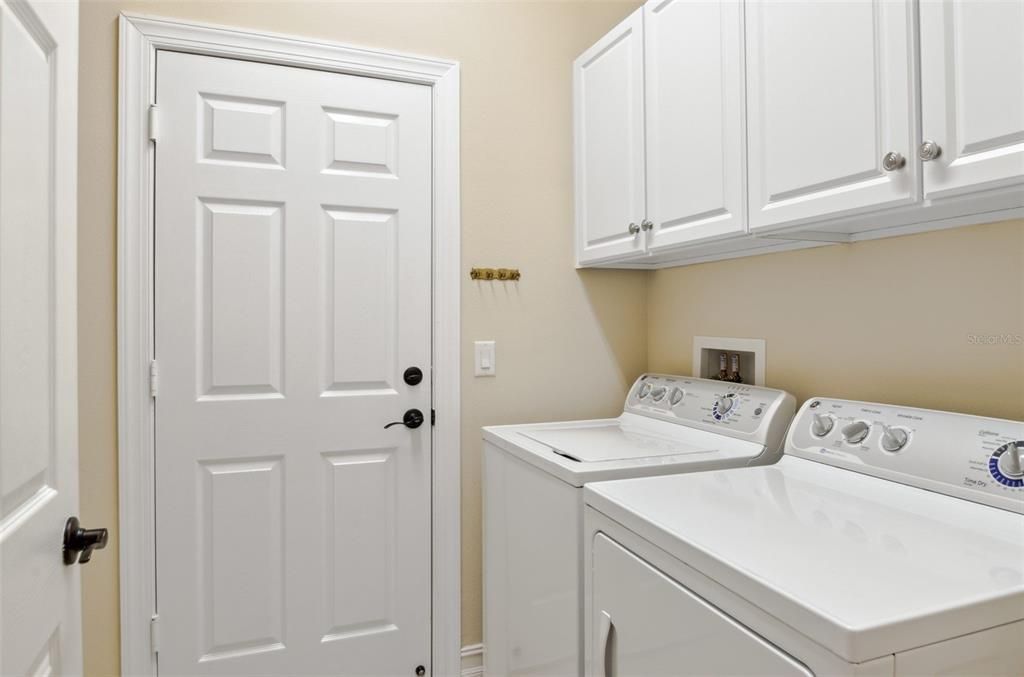 Laundry Room with Cabinets and Utility sink