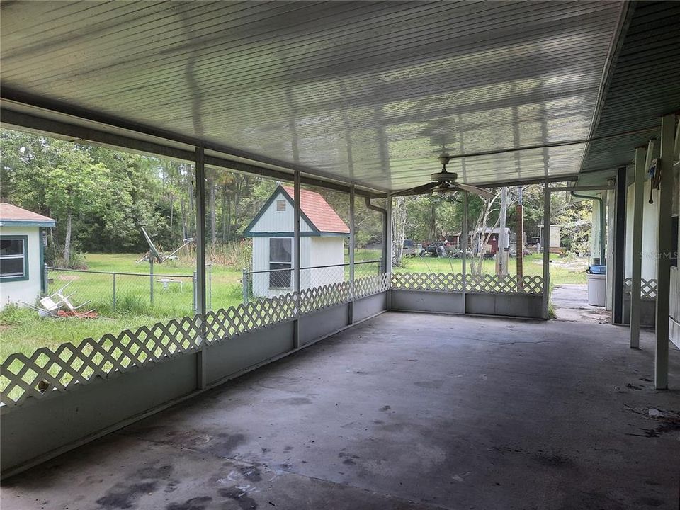 Screened Back Porch with view of Pump House