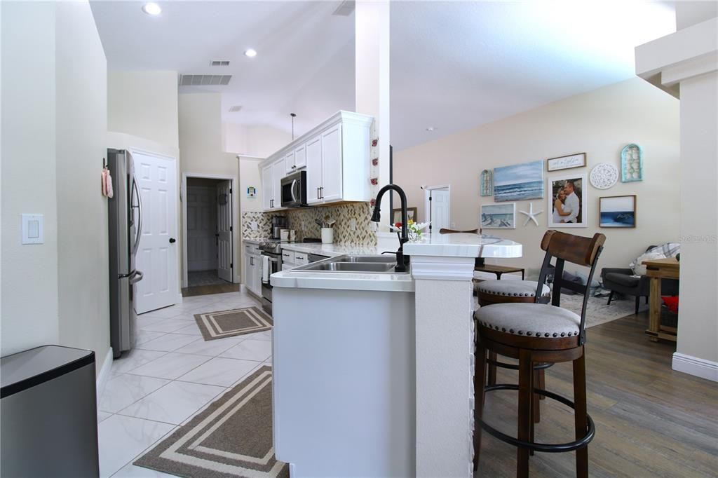 Kitchen opens up to living room and 2nd entertainment area