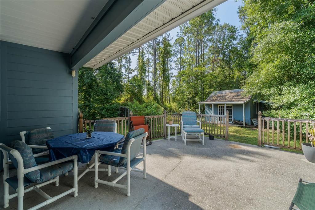 The PATIO extends out for plenty of room for seating, grilling or entertaining! With a wooded view and the sprawling acreage it is a blank canvas to create the backyard of your dreams, complete with a shed and detached 3-car garage for all your hobbies!