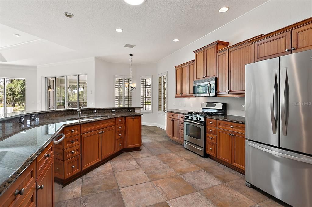 Very large eat in kitchen with Upgraded stainless appliances & tile floor