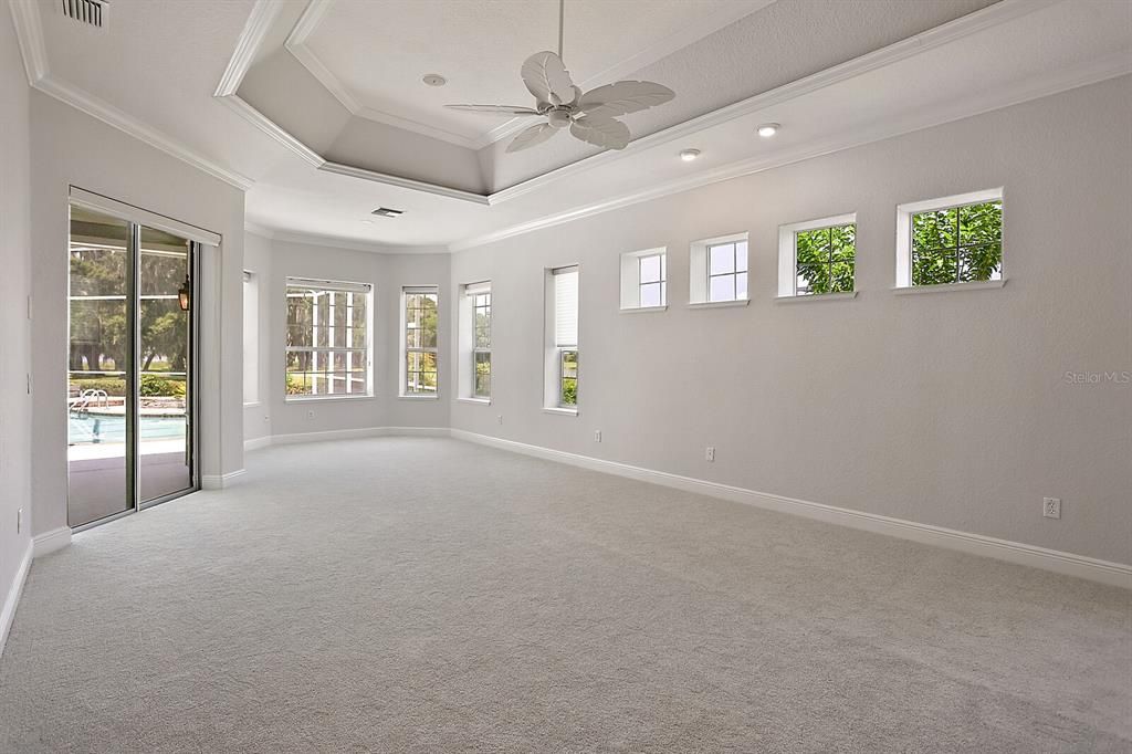 Master suite with Tray ceiling, Sitting area & Access to lanai