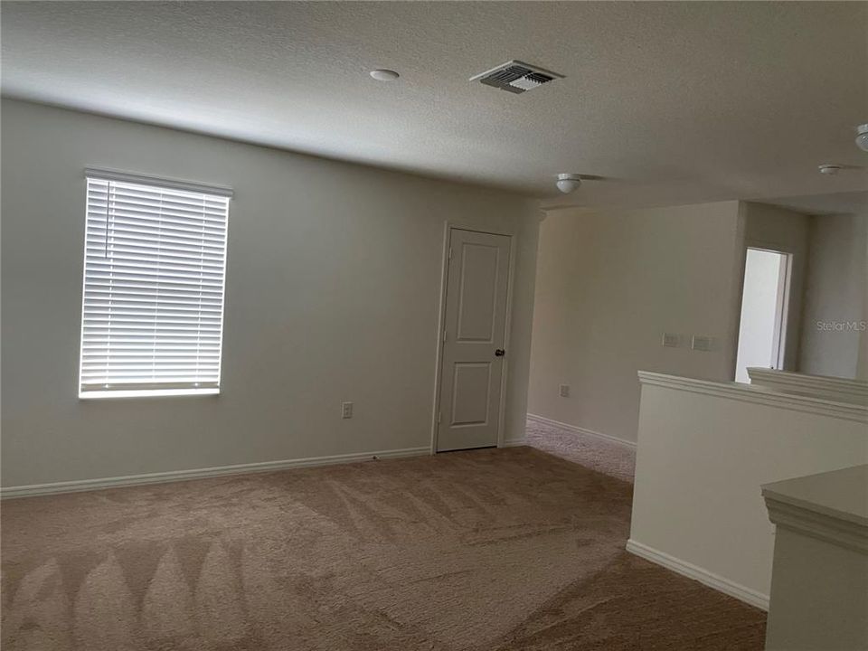 Enlarge game or family  room upstairs