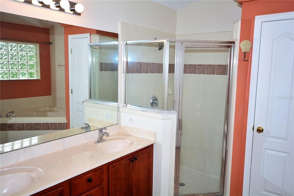 Primary Bedroom Bathroom with Double Sinks, Tub and Separate Shower