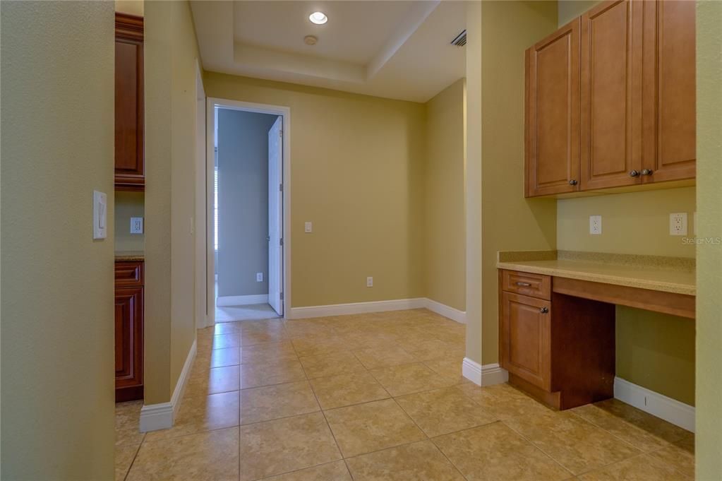 desk next to the kitchen