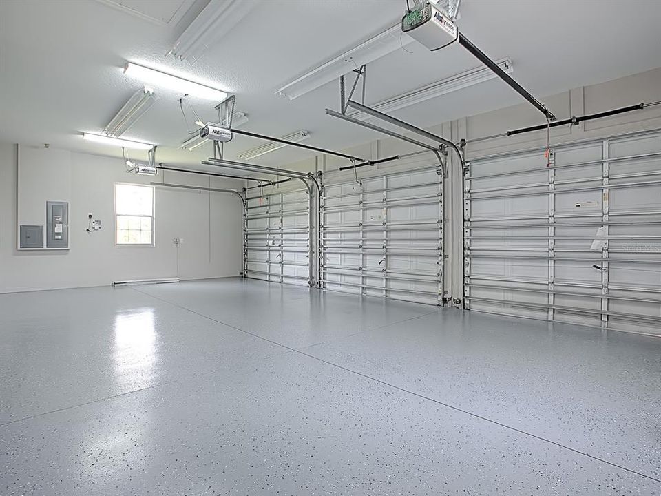 WOW!  WHAT A GARAGE!  THE WALLS WERE JUST PAINTED AND NEW EXPOXY PAINTED FLOORING! 3 NEW GARAGE DOOR OPENERS WERE JUST ADDED!