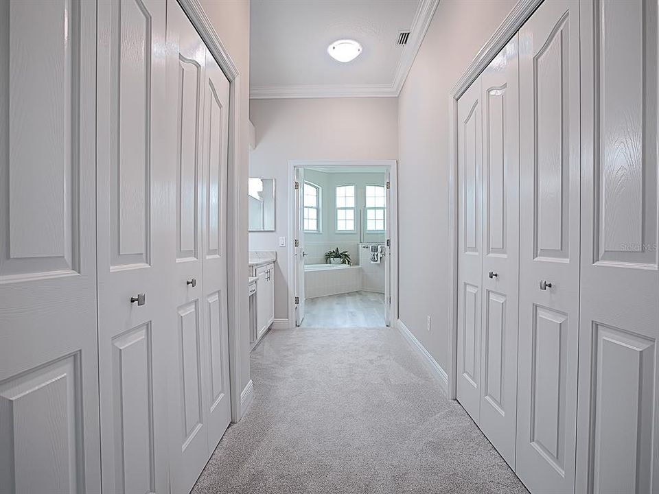 SO MUCH CLOSET SPACE!  EXTRA CLOSET SPACE AND SHELVING ON THE LEFT AND A 2ND WATER HEATER. HUGE WALK-IN CLOSET ON THE RIGHT!