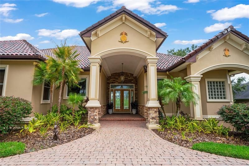 Stone accents warm your grand entryway...