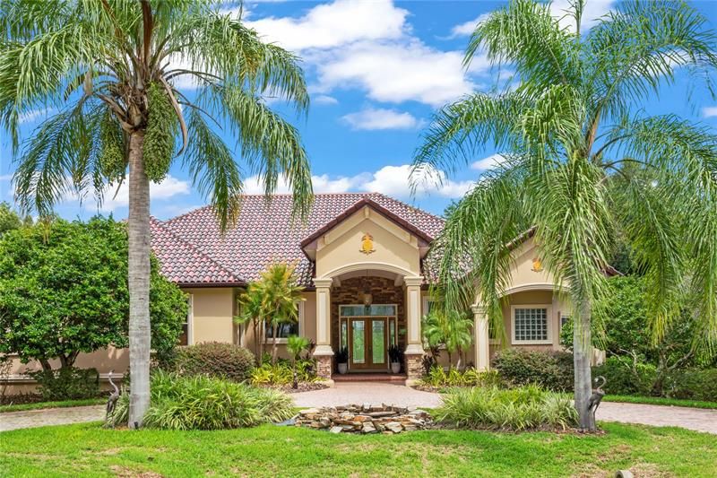 Tropical landscape and water feature welcome you...