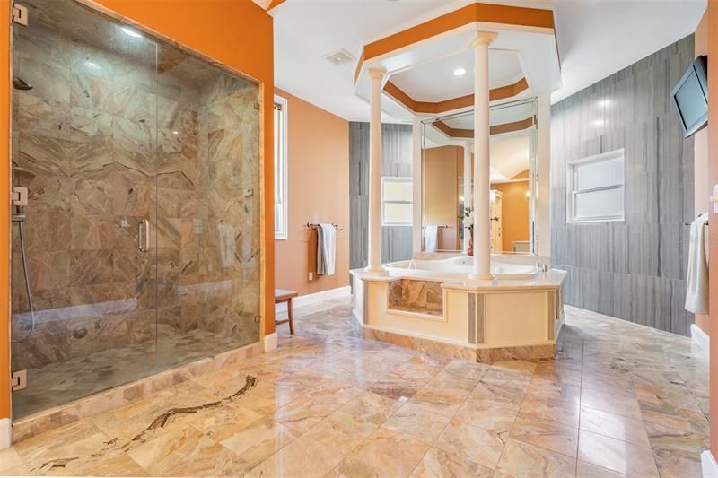 Striking steam shower with Stunning floors!