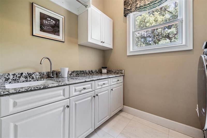 Interior laundry room with sink