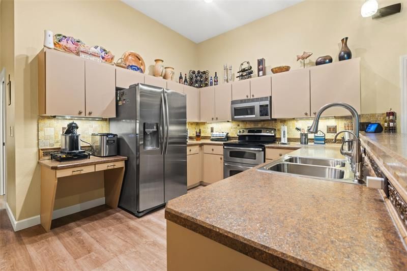 View of the spacious kitchen with plenty of cabinet space for all your kitchen essentials