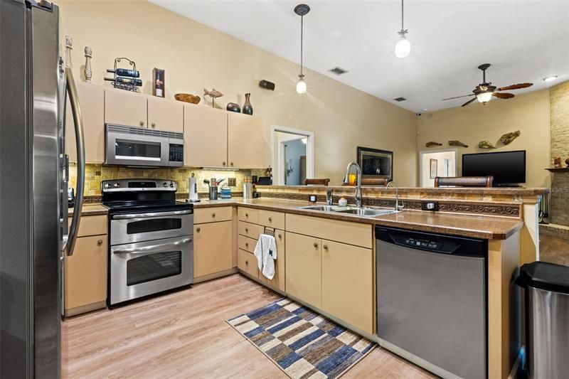 Open kitchen with engineered hard wood floors