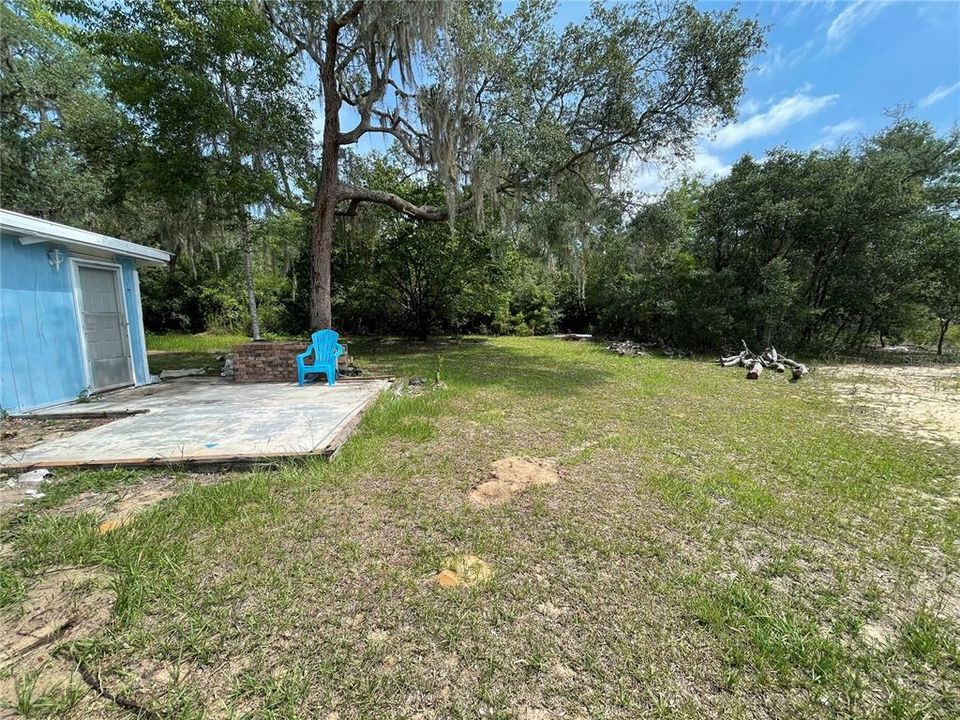 Concrete Pad to Rear Side of Home