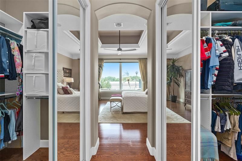 His-and-Her walk-in closets flank the passage between the Master Bath and Master Bedroom