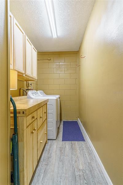 Laundry room with folding area and storage.