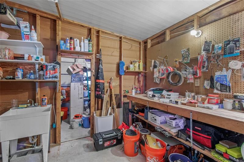 Workshop & Laundry. Golf Cart Garage is Through the Door, Which Can Also Be Used for Additional Storage.
