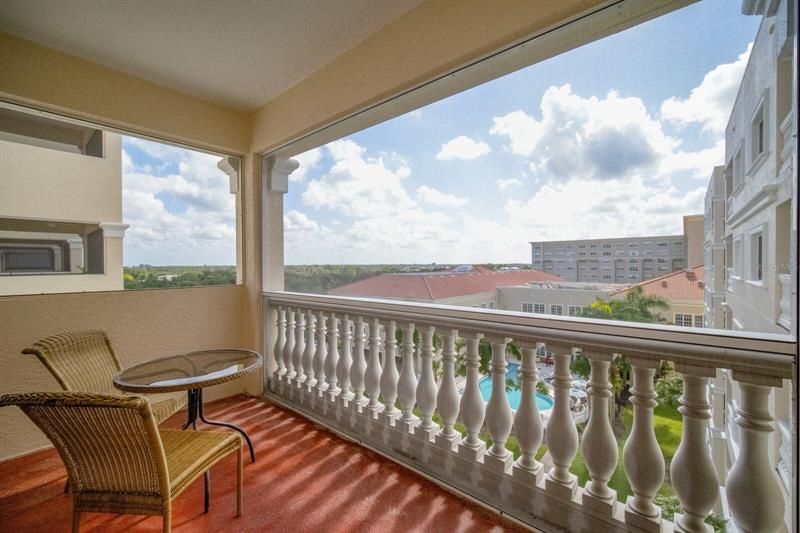 the screened balcony where you can enjoy morning coffee or evening glass of wine