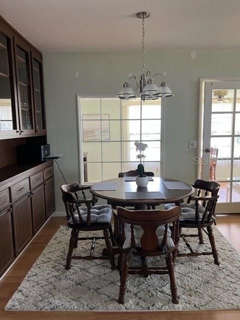 View of Dining area from kitchen and into the Florida Room Light and Bright