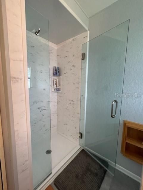 Shower door swings out or in.