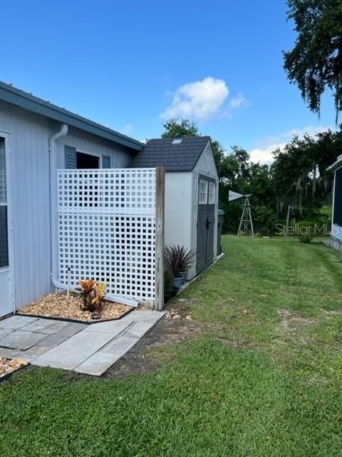 extra patio area with place for Grill, new storage shed and place for garbage bins