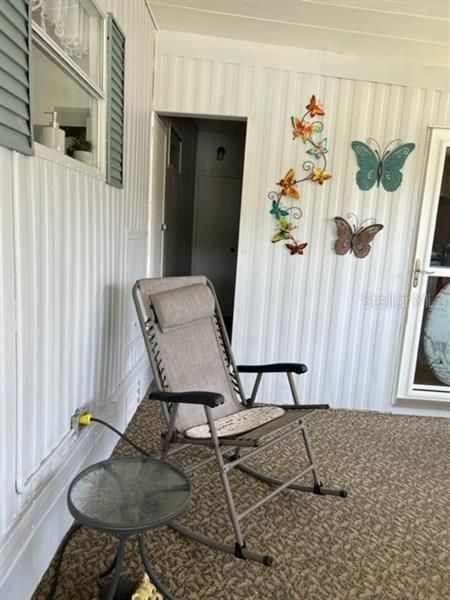 Screened in porch, with door to outside, door to laundry area and on left extra storage