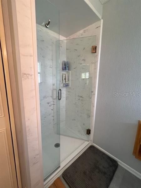 Shower door swings out or in