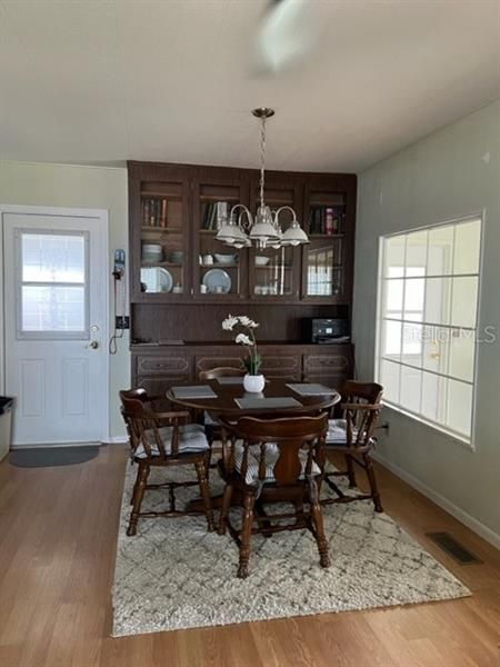 Dining area with built in China Cabinet, large window to view Florida Room and outside.