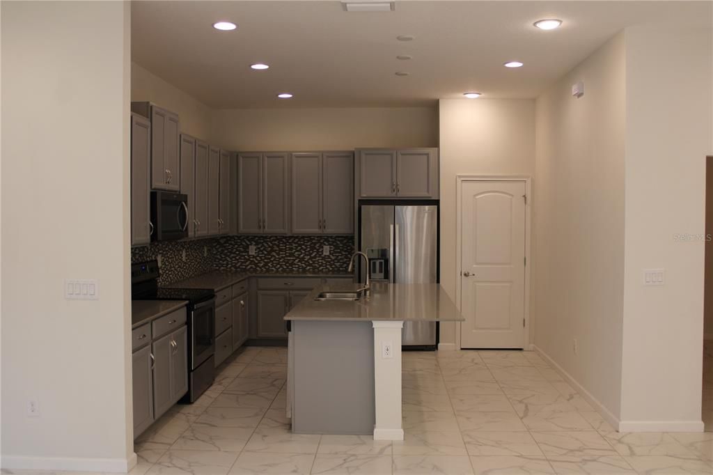 Looking into kitchen from breakfast area