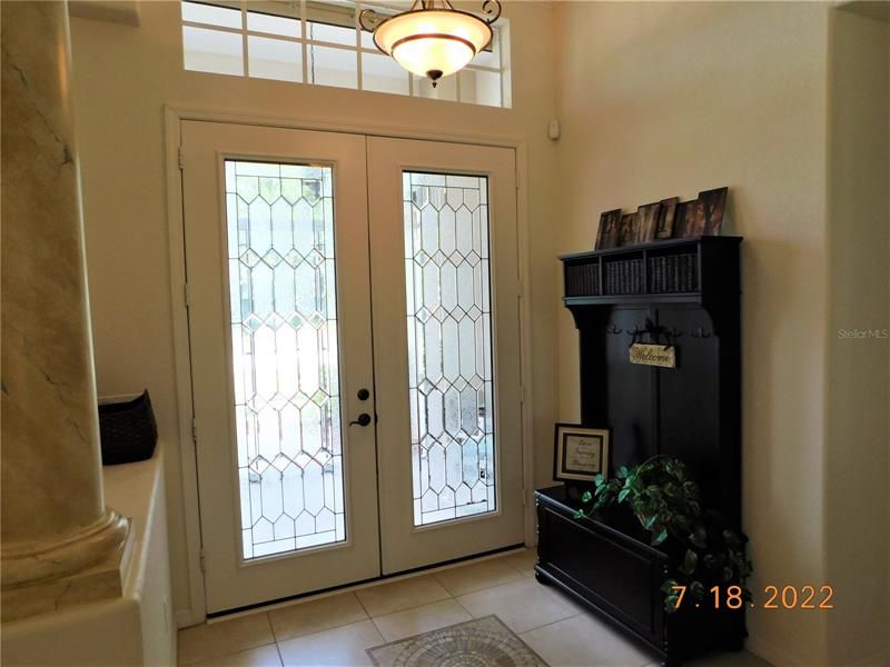 Amazing foyer entrance with inlaid mosaic.