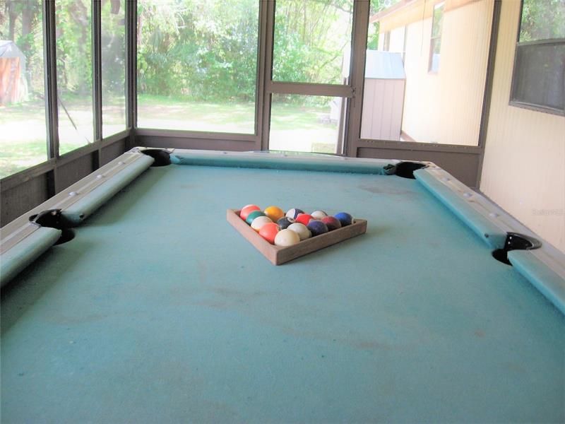 POOL TABLE CONVEYS IN SCREENED PORCH