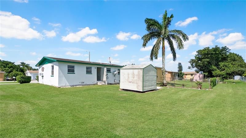 Beautiful Landscaping including a Tall Cuban Royal Palm in Backyard Gives CURB APPEAL!  Bonus SHED Included in Backyard gives Extra & Secure Storage too! Nice!