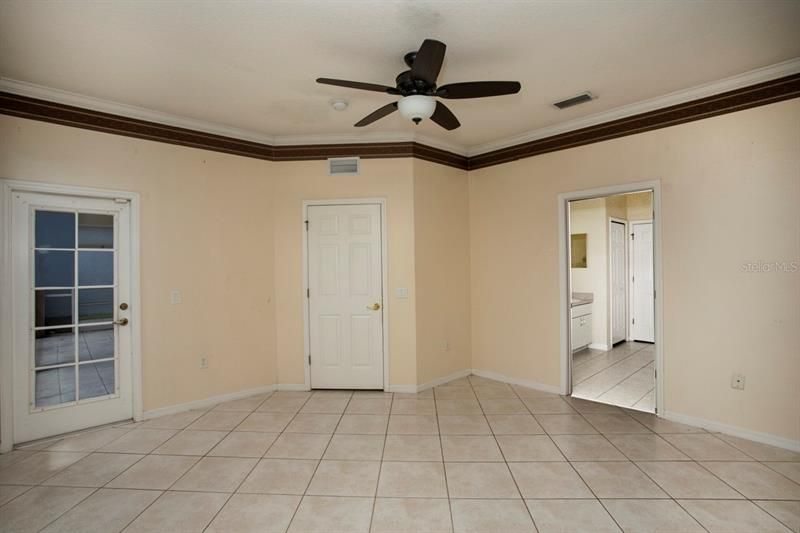 OWNER SUITE ON FIRST LEVEL WITH EXIT TO REAR LANAI/PORCH.