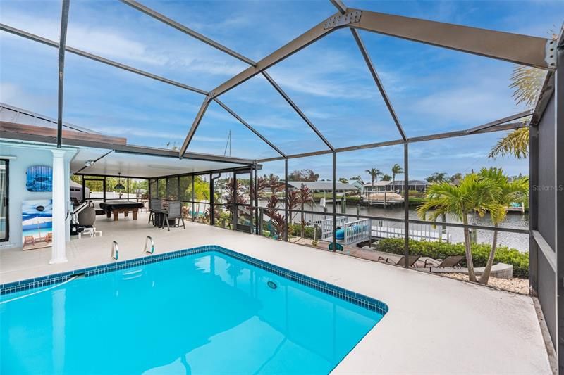 Enjoy the outdoor pool table while watching for dolphins and other wildlife in the canal.