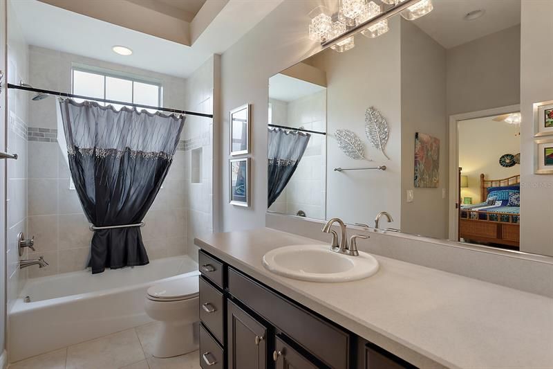 Guest bathroom w/Tiled tub & shower combination