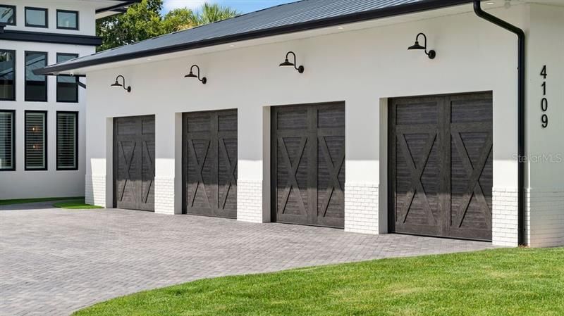 4 car garage with epoxy floors, custom storage and 3 cooling and heating split systems.  There is also an additional 1 car garage.
