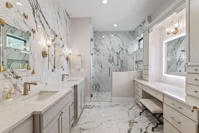 Gorgeous master bathroom with dual sinks, make-up vanity, walk-in shower and toilet closet