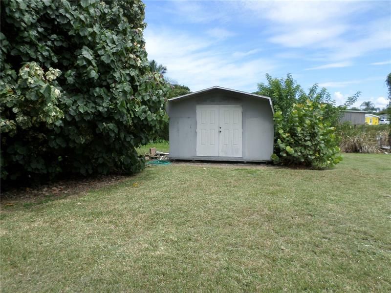 STORAGE BUILDING WITH WINDOW A/C UNIT