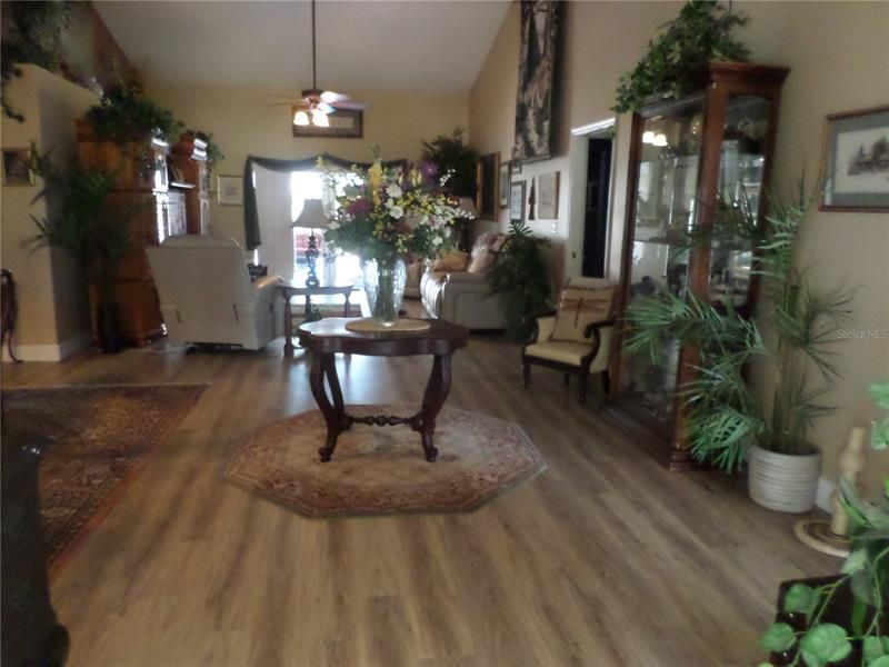 WIDE FOYER OPENS TO LIVING ROOM ALL VAULTED