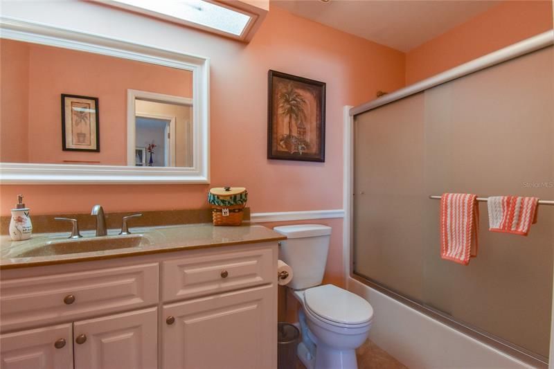 Guest Bathroom Frameless Slider Doors to Tub/Shower