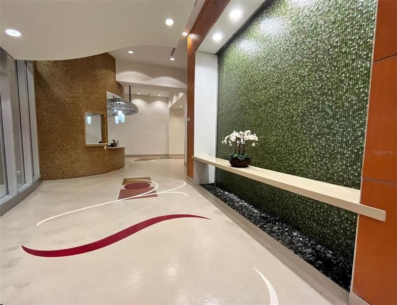 Concierge desk and entrance fountain wall