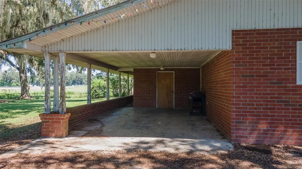 Spacious Carport with side entrance to home
