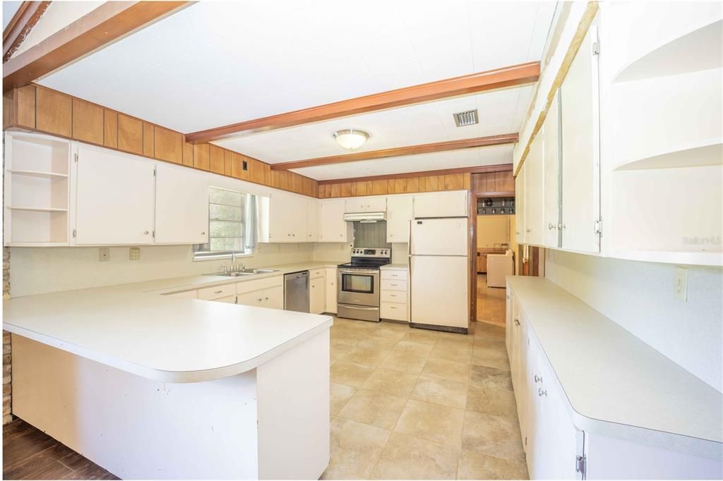 Kitchen with eat-in dining, ample counter space, and appliances