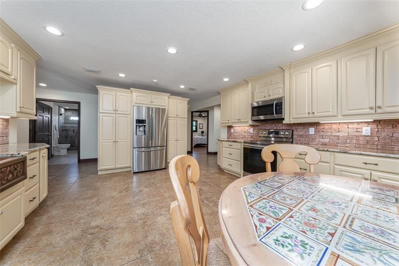 Two custom pantries, one on each side of the refrigerator.