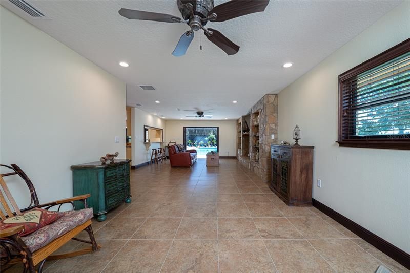 There are so many ways to use this room. This can be an area for a large table if you don't want a table in the kitchen. Can be a area to play table games or even a pool table. Options are endless when you have this much space!