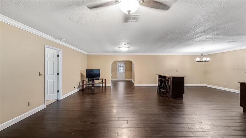 Walking in front doors to living room/dining room, kitchen to the right