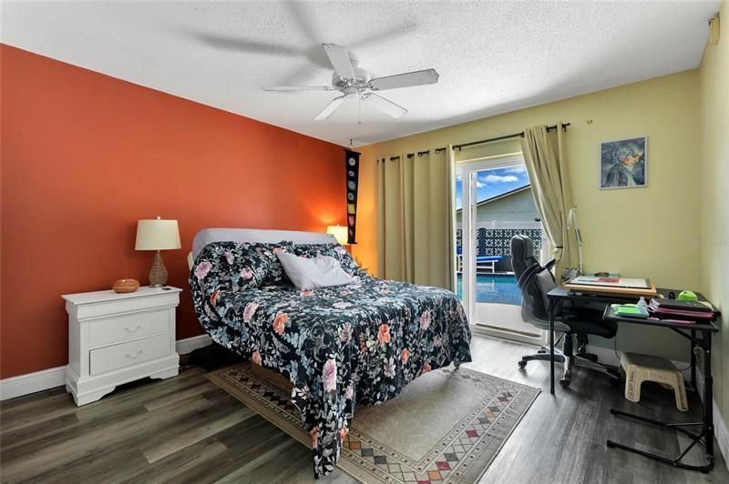 The second bedroom has access to the POOL and delivers a full bath - perfect for guests or an IN-LAW SUITE!