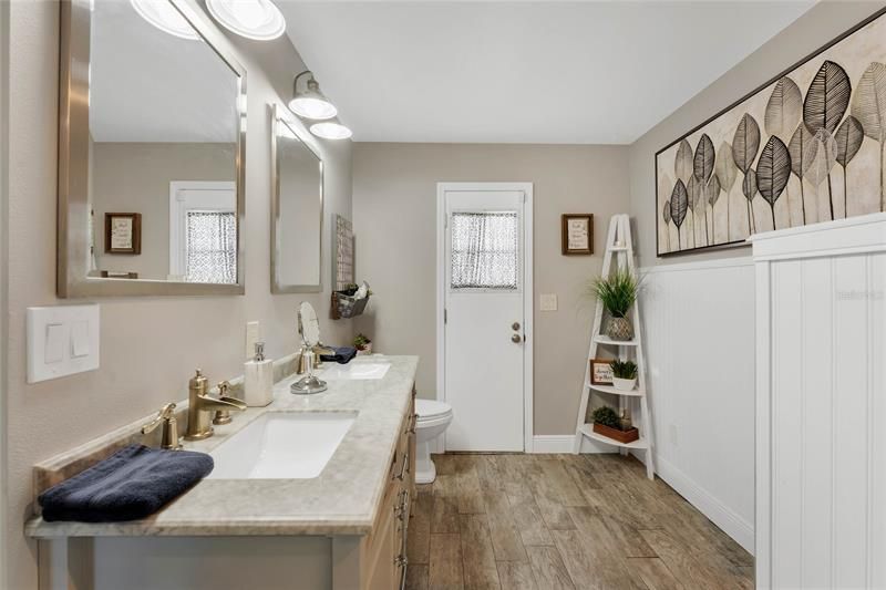 Escape into the REMODELED (2021) en-suite bath that offers an oversized shower and an expansive DUAL SINK VANITY!