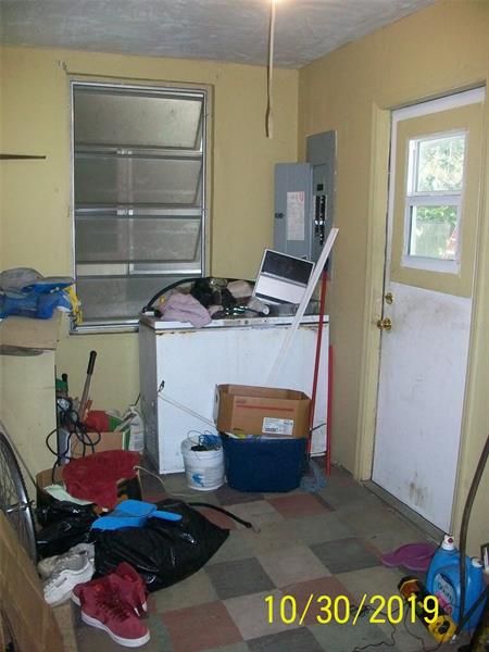 Utility Room with door leading to backyard from Kitchen view