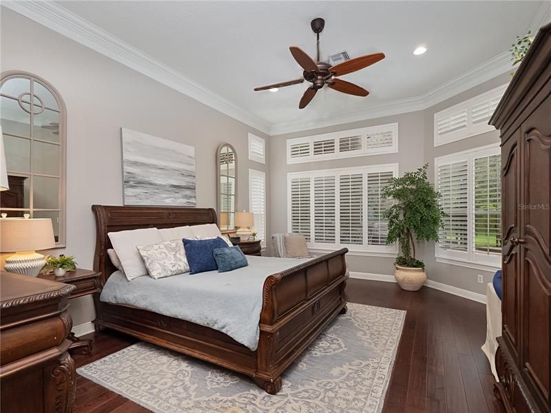 Master Bedroom with sitting area overlooking the pool area